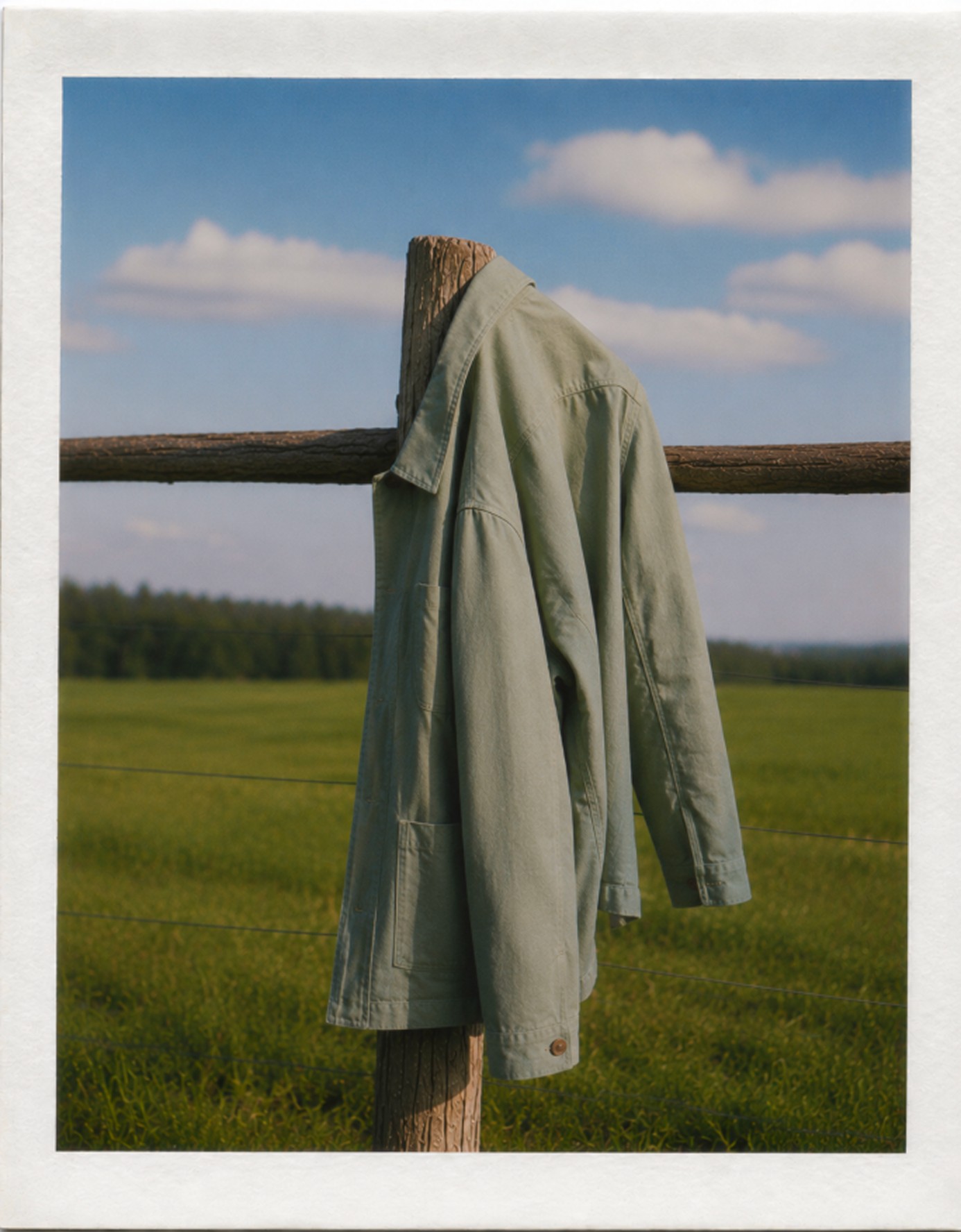 Editorial image of jacket hanging on a fence